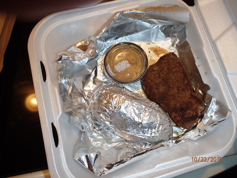 Steak and baked potatoe in delivery container Rollin Delivery and Errands